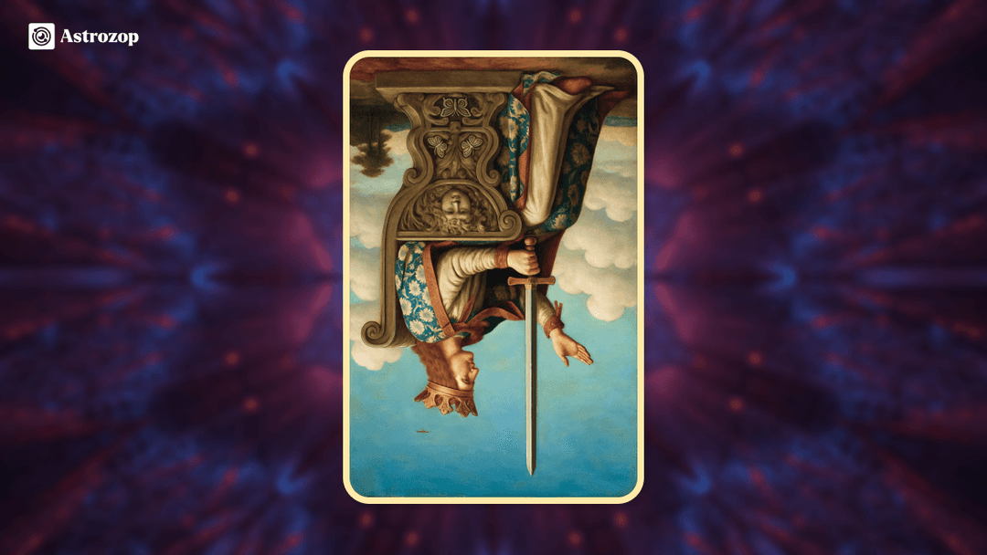 Reversed Queen of Swords tarot card showing a queen with a downward sword